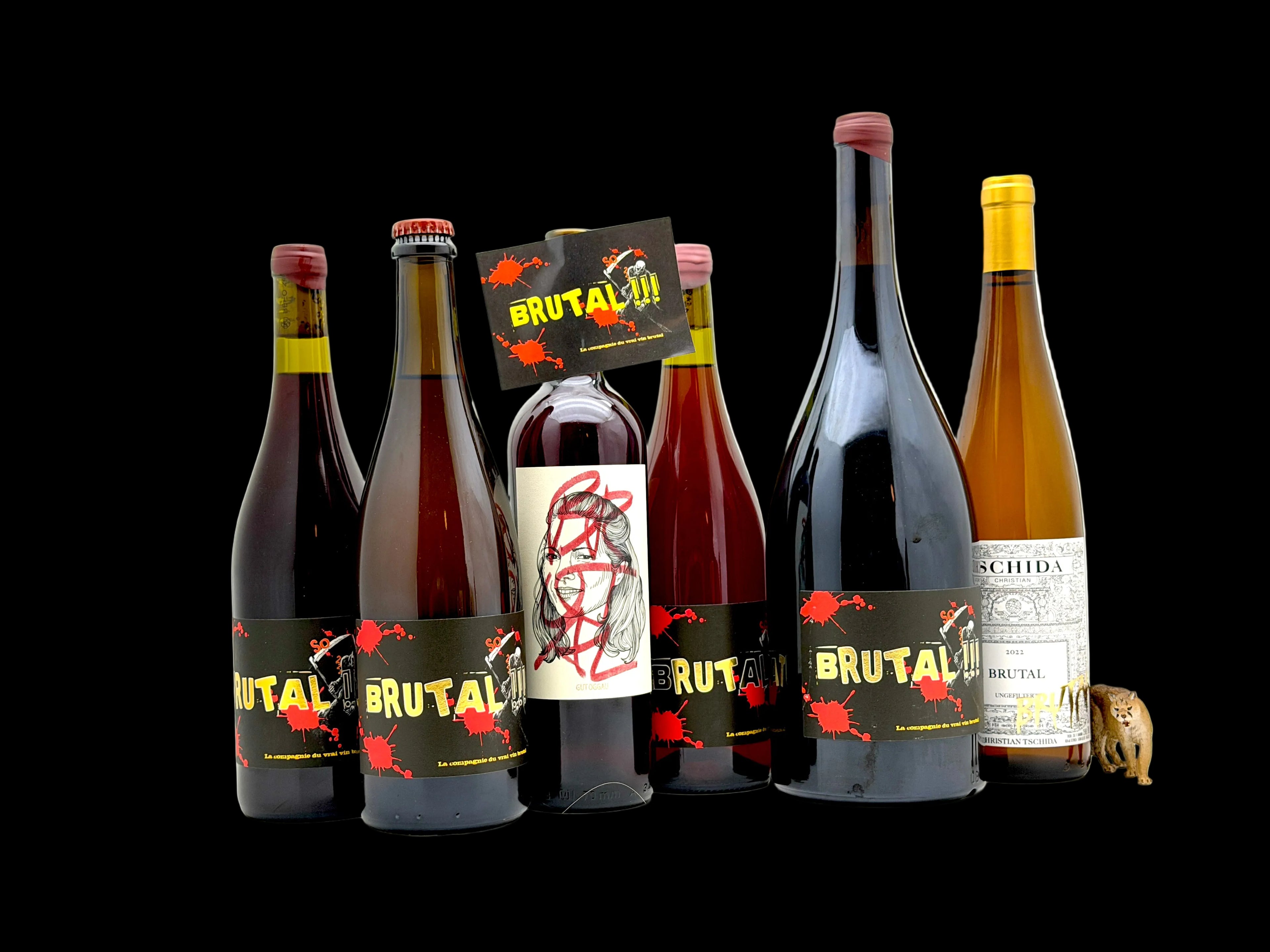 Collection of wine bottles with Brutal label on a white background